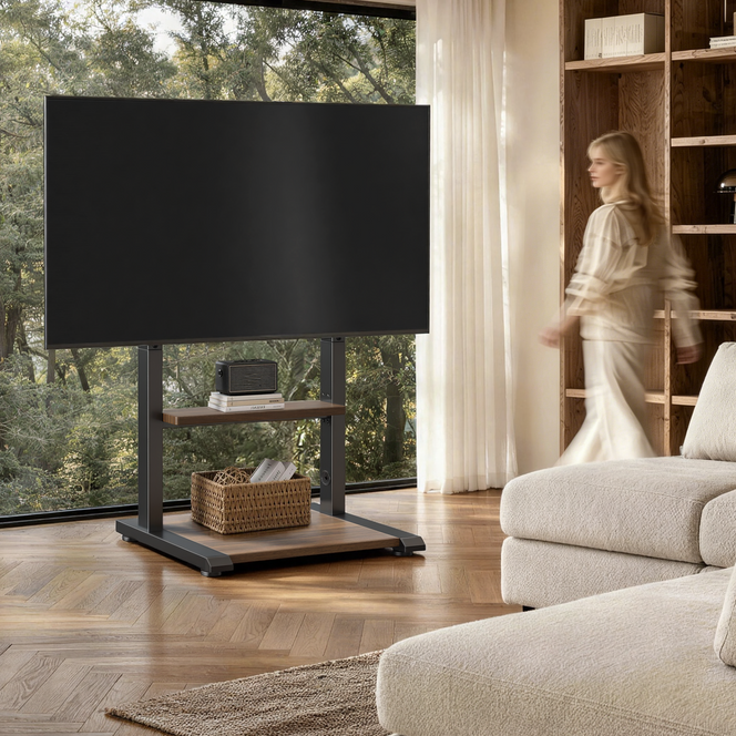 Sturdy floor TV stand with a wide base supporting a large TV in a living room with a pet nearby, designed for stable home entertainment setups.
