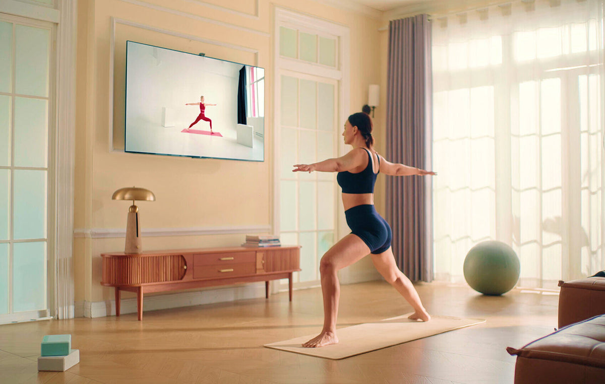 A living room: stretching with the screen turned to face the mat