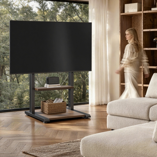 Sturdy floor TV stand with a wide base supporting a large TV in a living room with a pet nearby, designed for stable home entertainment setups.