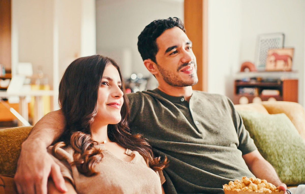 A couple on the sofa watching together
